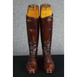 A pair of vintage brown leather ladies riding boots within shoe trees. H.47. No size.