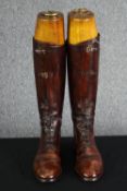 A pair of vintage brown leather ladies riding boots within shoe trees. H.47. No size.