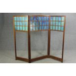 An oak and glass panelled Arts and Crafts folding room divider, early 20th century. H.141 W.160cm.