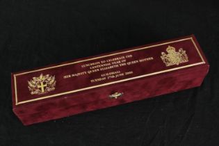 A boxed luncheon menu scroll to celebrate the centennial of The Queen Mother in 2000. H.39 W.29cm.