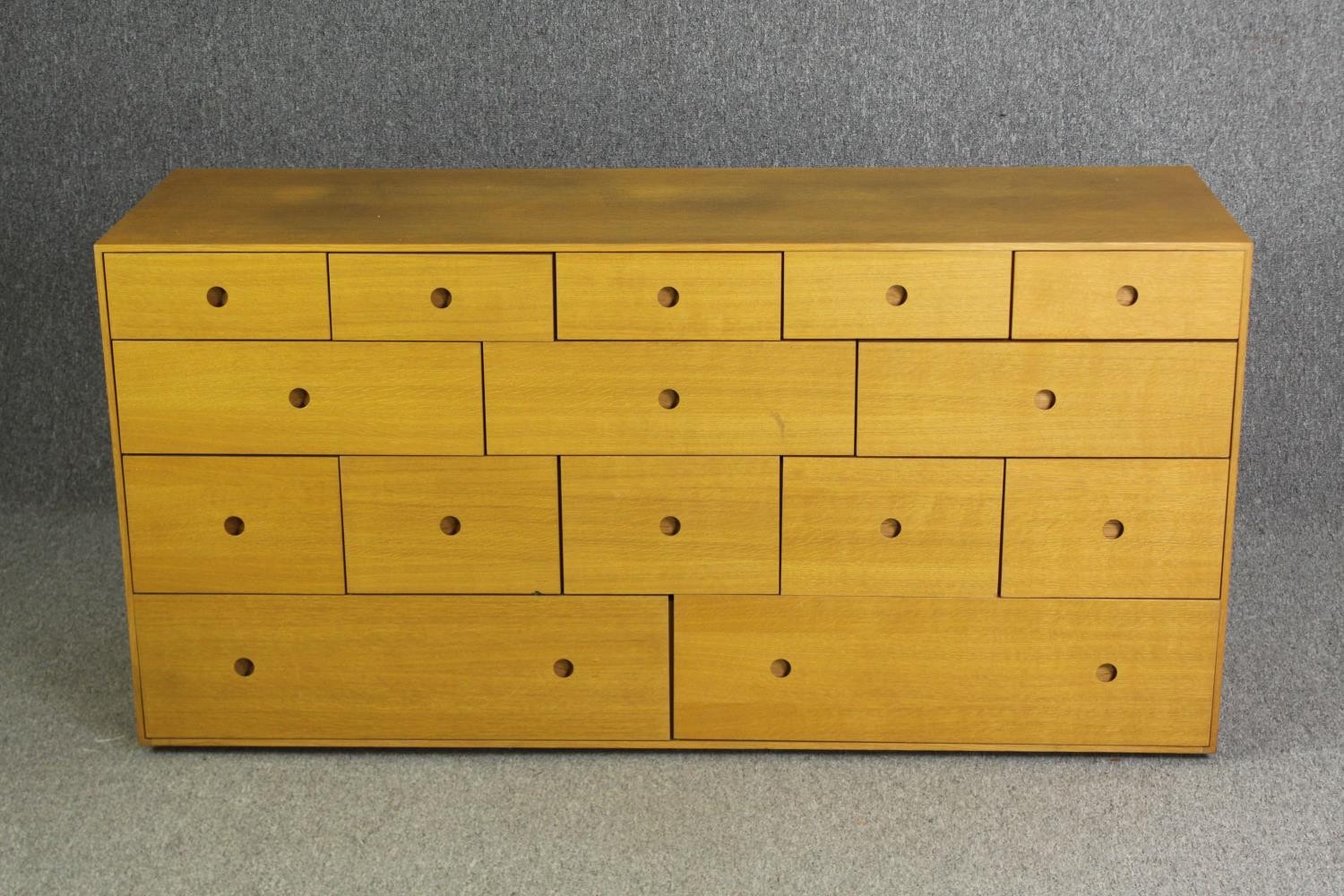 A contemporary light oak chest of drawers, H.73 W.150 D.48cm. - Image 4 of 7