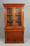 Library bookcase, 19th century mahogany in two sections. H.200 W.103 D.39cm.