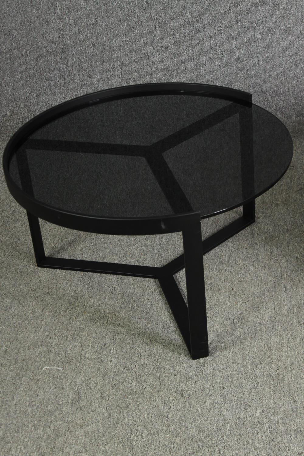 Two contemporary coffee tables with tinted glass tops and black metal supports. H.35 Dia.89cm. ( - Image 3 of 10