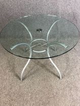 A contemporary glass and metal occasional table. H.72 Dia.100cm. (Associated pieces, top not