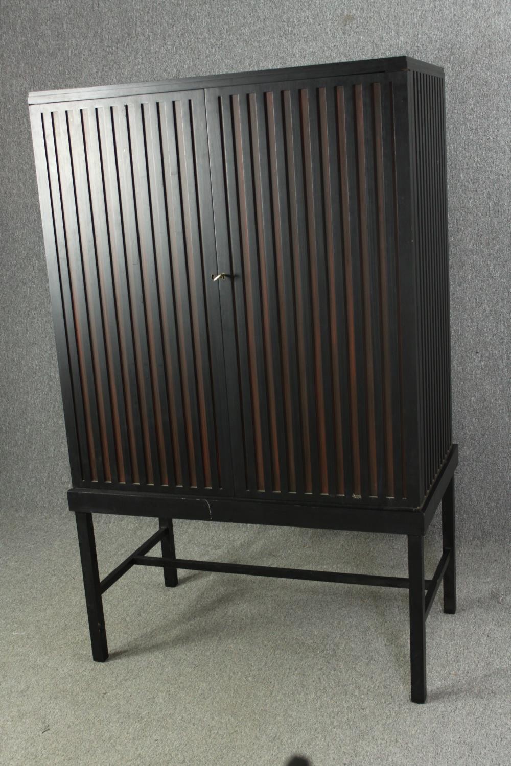 A contemporary ebonized cabinet on stand. H.169 W.102 D.60cm. - Image 3 of 7
