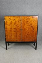 Hall cupboard or linen cabinet on stand, mid century ebonised and section veneered birch. H.139 W.