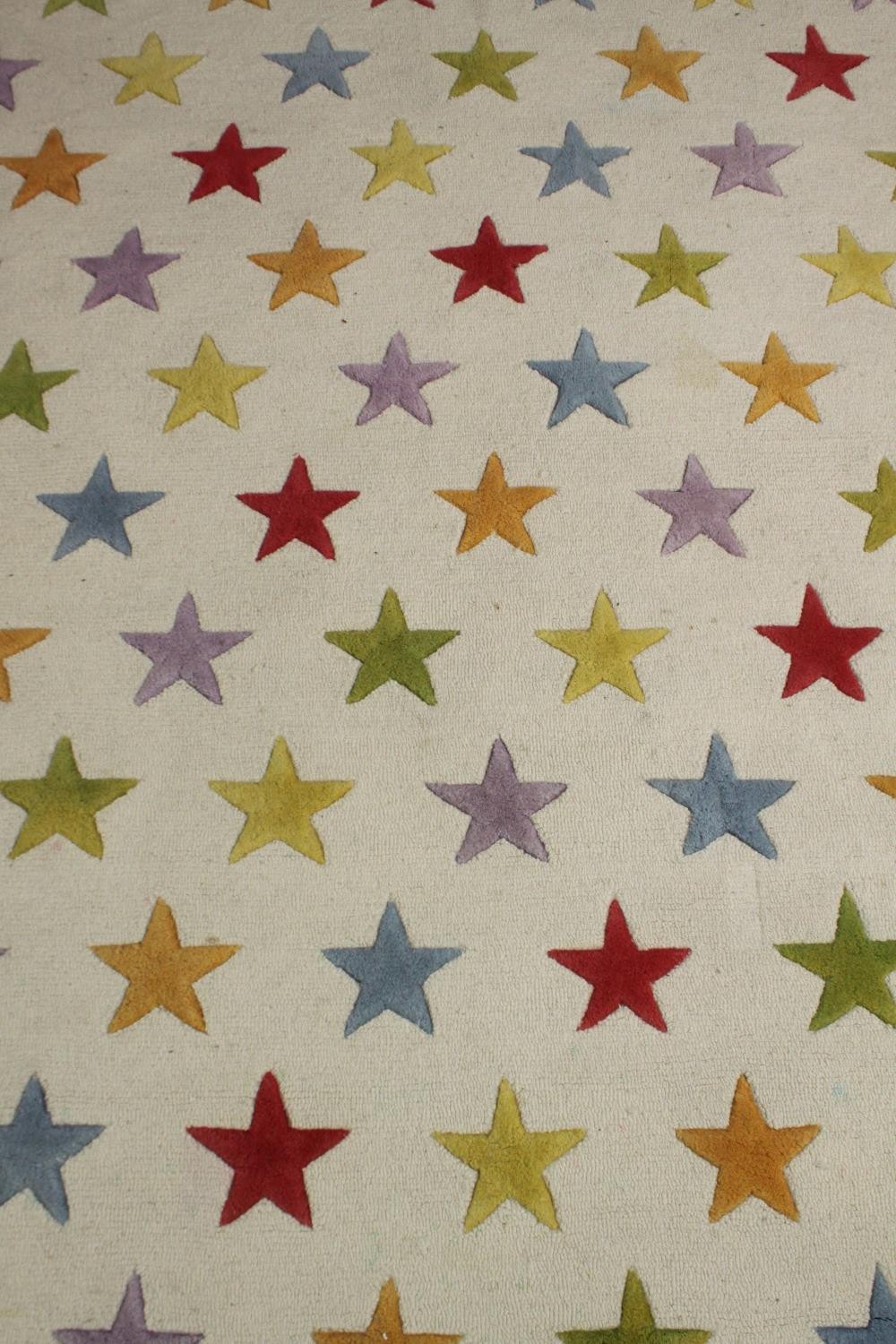 A modern carpet with star pattern. L.200 W.142cm. - Image 2 of 3
