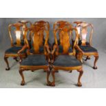 A set of ten George II style walnut and upholstered dining chairs, including two carvers