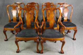 A set of ten George II style walnut and upholstered dining chairs, including two carvers