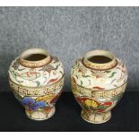 A pair of early 20th century Japanese Satsuma Kinkozan Asano Zo hand painted vases with stylised