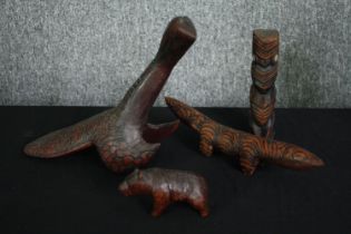A collection of four carved hardwood animal figures. L.26cm. (largest).