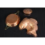 Three copper items including a jelly mould in the form of a fish. L.31 W.20cm.