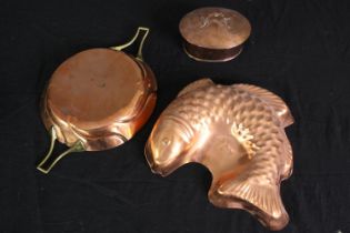 Three copper items including a jelly mould in the form of a fish. L.31 W.20cm.