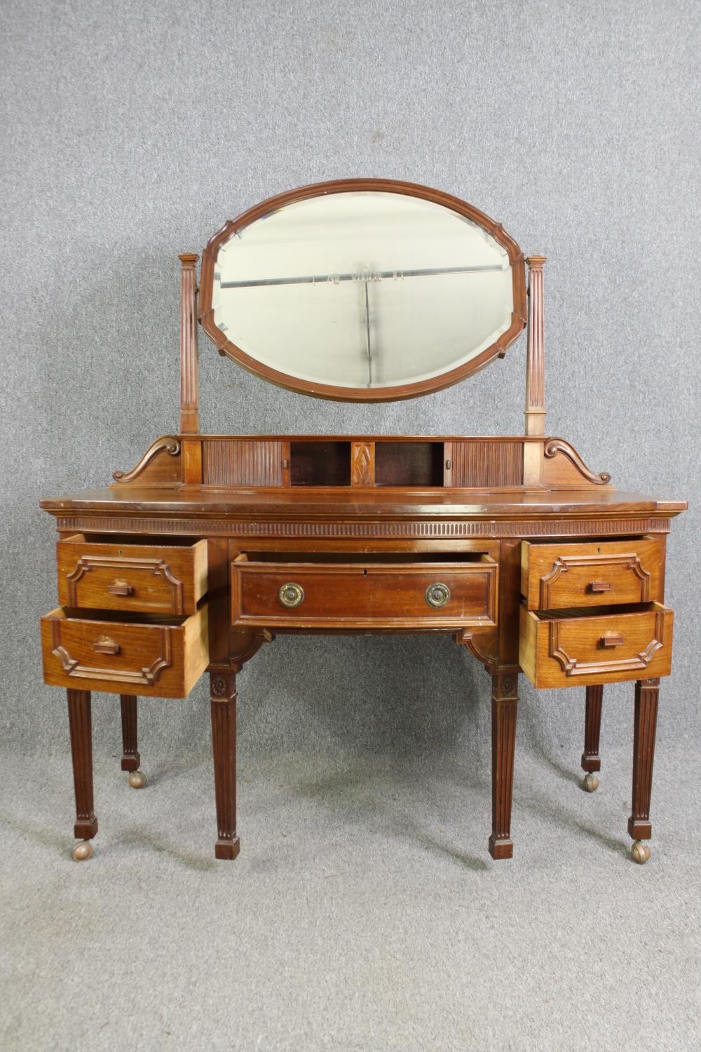 A George III style walnut dressing table, 20th century. H.164 W.136 D.63cm. - Image 2 of 10