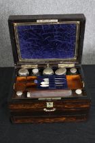 A Victorian coromandel travelling vanity box, with associated silver and glass fitted interior, H.18