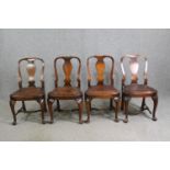 A set of four early 20th century oak George I style dining chairs with leather seats. (One stretcher
