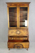A Queen Anne style walnut and oak bureau bookcase, first quarter 20th century. H.214 W.92 D.50cm.