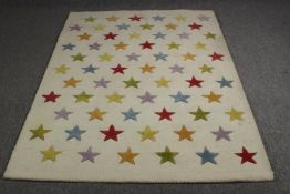 A modern carpet with star pattern. L.200 W.142cm.