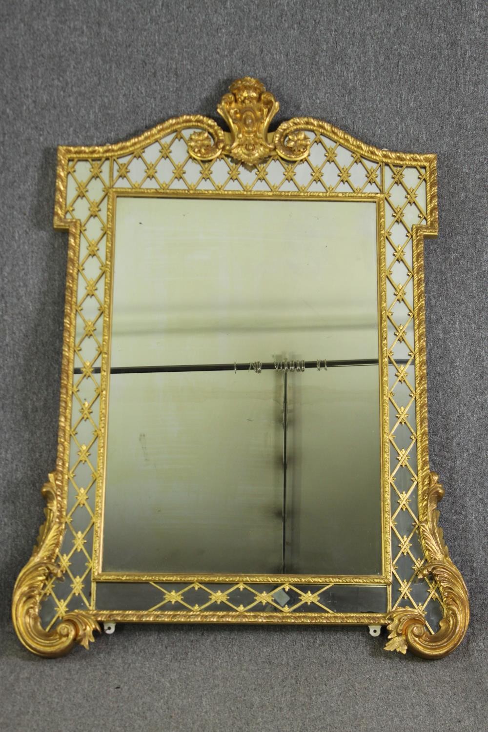 A 19th century Régence style carved giltwood overmantel mirror. H.157 W.115cm.
