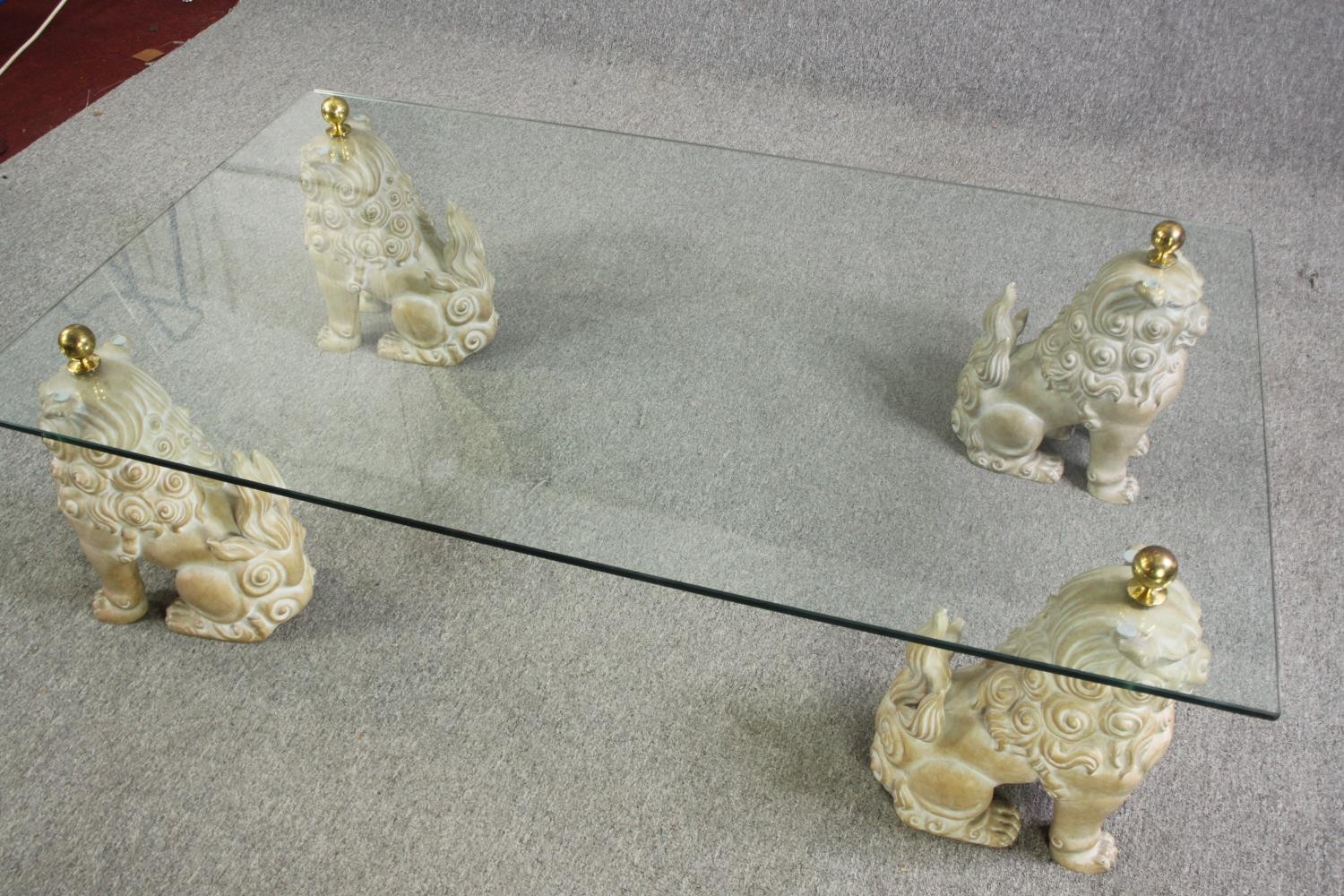 An unusual glass coffee table, with painted fu dog supports, 20th century. H.39 L.152 W.92cm. - Image 3 of 11