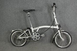 A Brompton folding bike, H.107 L.150cm.