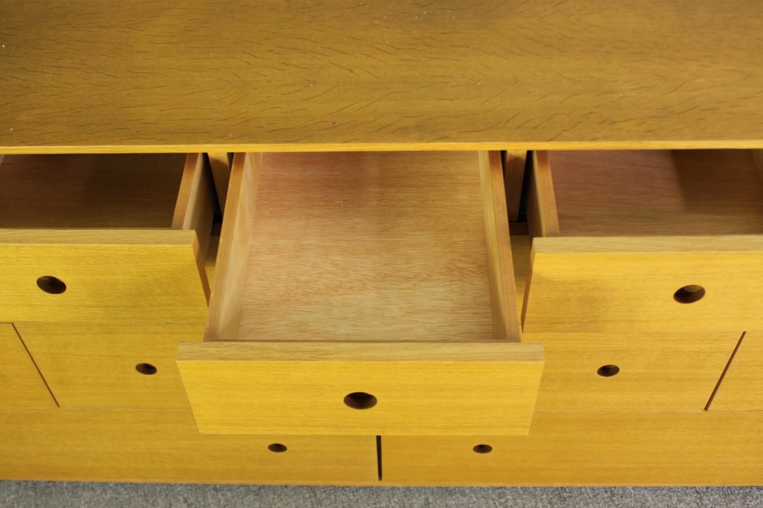 A contemporary light oak chest of drawers, H.73 W.150 D.48cm. - Image 7 of 7
