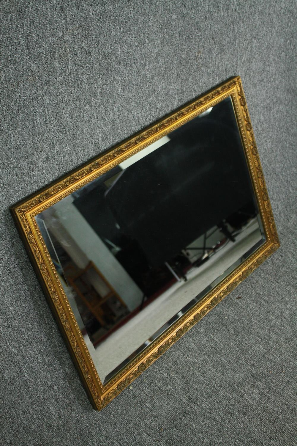 A contemporary gilt framed wall mirror. H.54 W.75cm. - Image 2 of 5