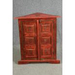 A simulated lacquered corner cabinet, hand painted. H.83 W.73 D.33cm.