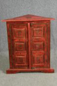 A simulated lacquered corner cabinet, hand painted. H.83 W.73 D.33cm.
