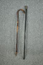 Two walking canes, one with a hallmarked silver handle. L.90cm. (largest)