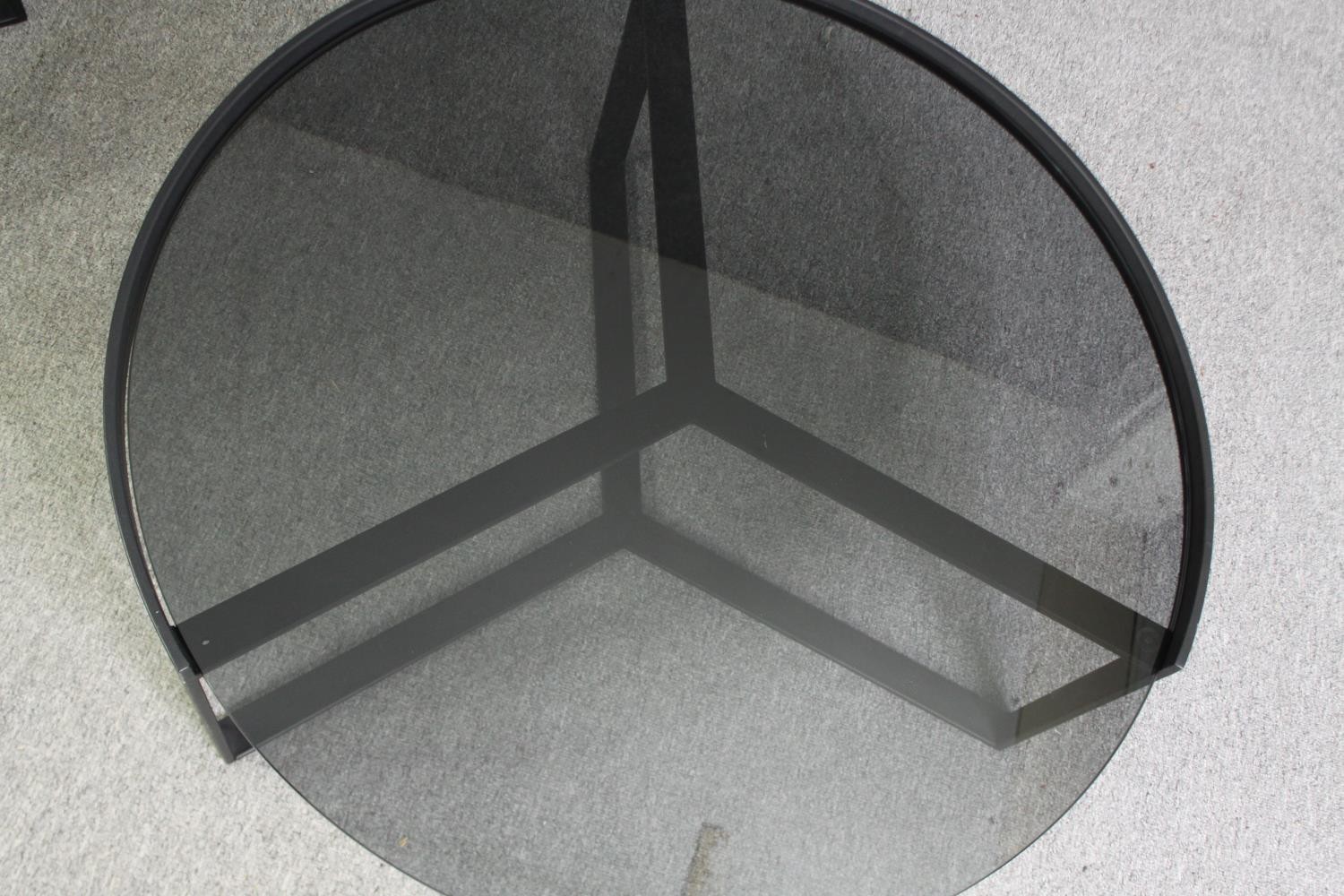Two contemporary coffee tables with tinted glass tops and black metal supports. H.35 Dia.89cm. ( - Image 8 of 10