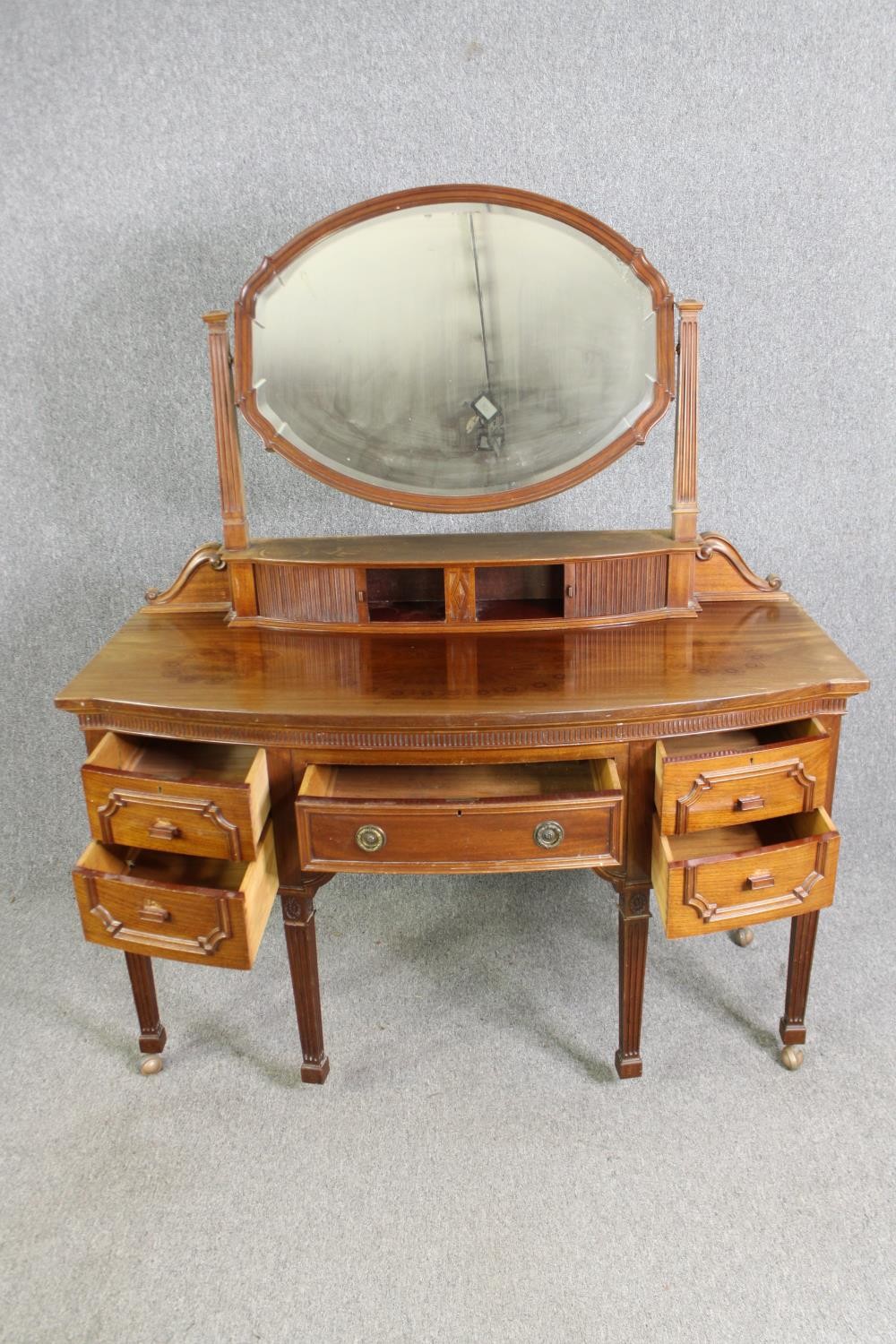 A George III style walnut dressing table, 20th century. H.164 W.136 D.63cm. - Image 5 of 10