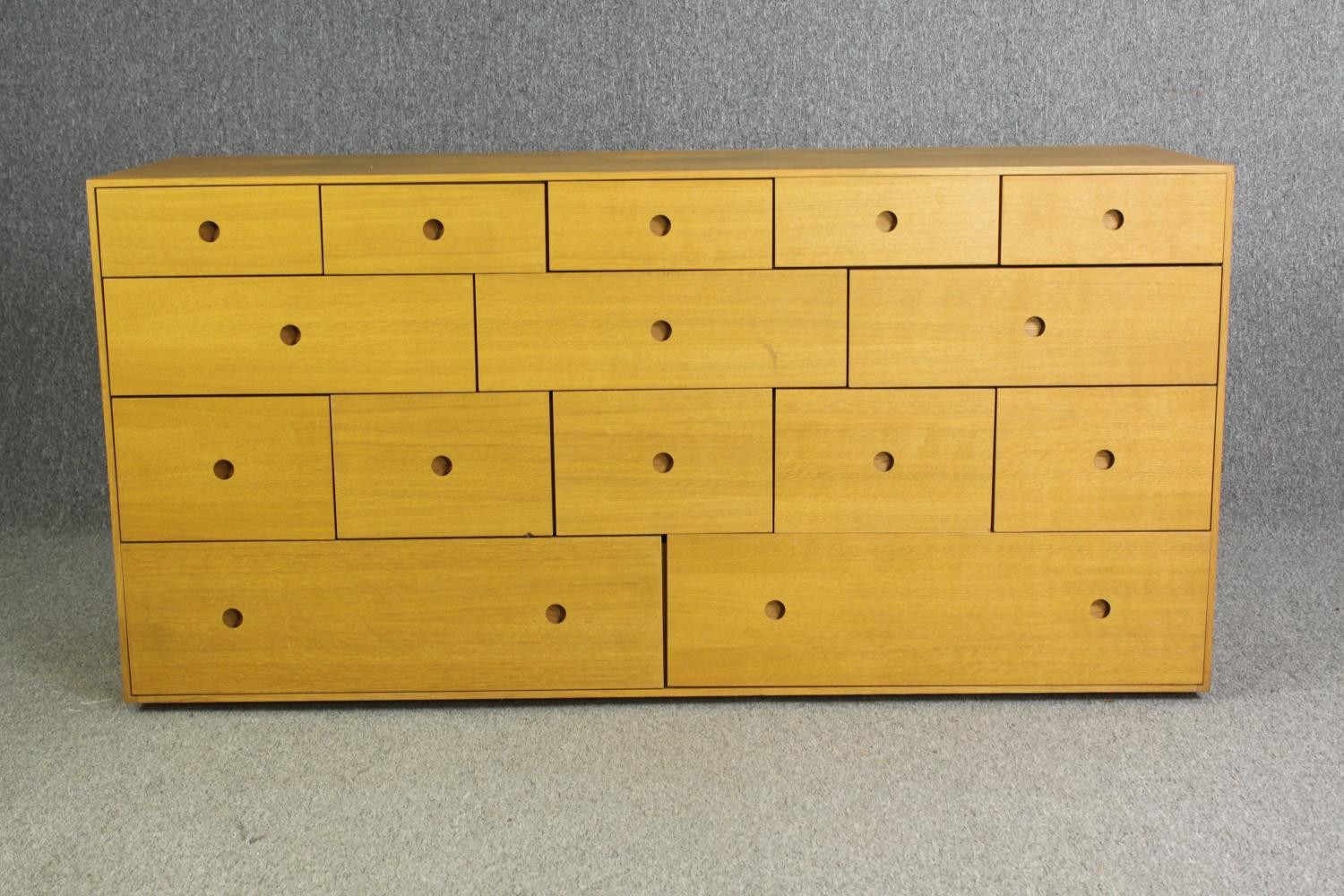 A contemporary light oak chest of drawers, H.73 W.150 D.48cm.