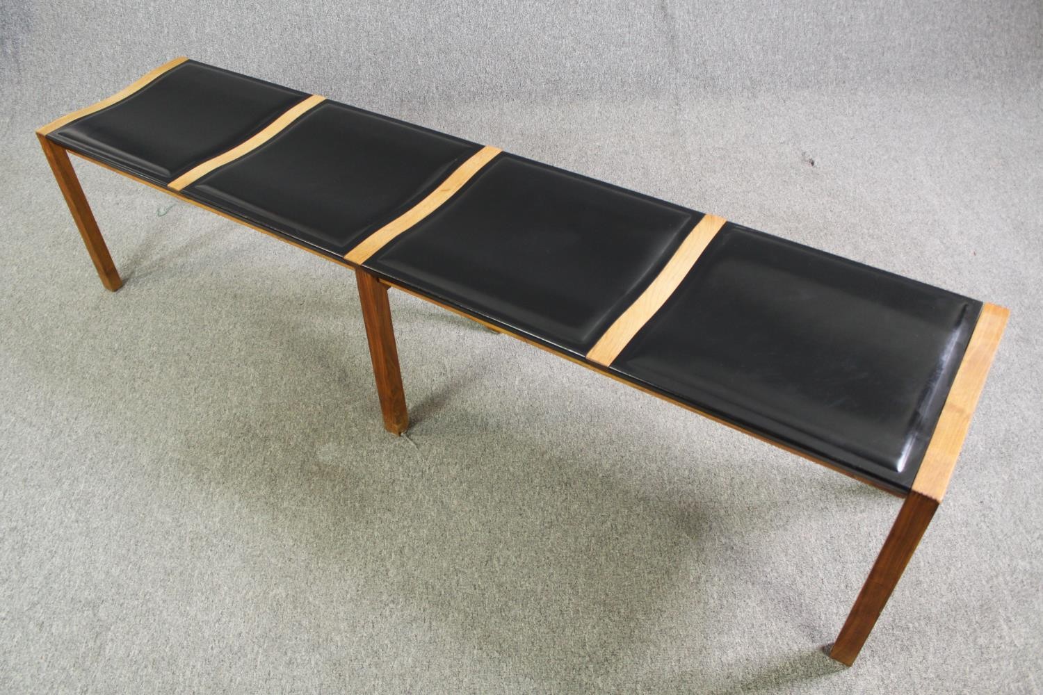 A pair of contemporary Heal's teak and black leather dining benches. H.48 W.200 D.45cm. (each). - Image 4 of 8