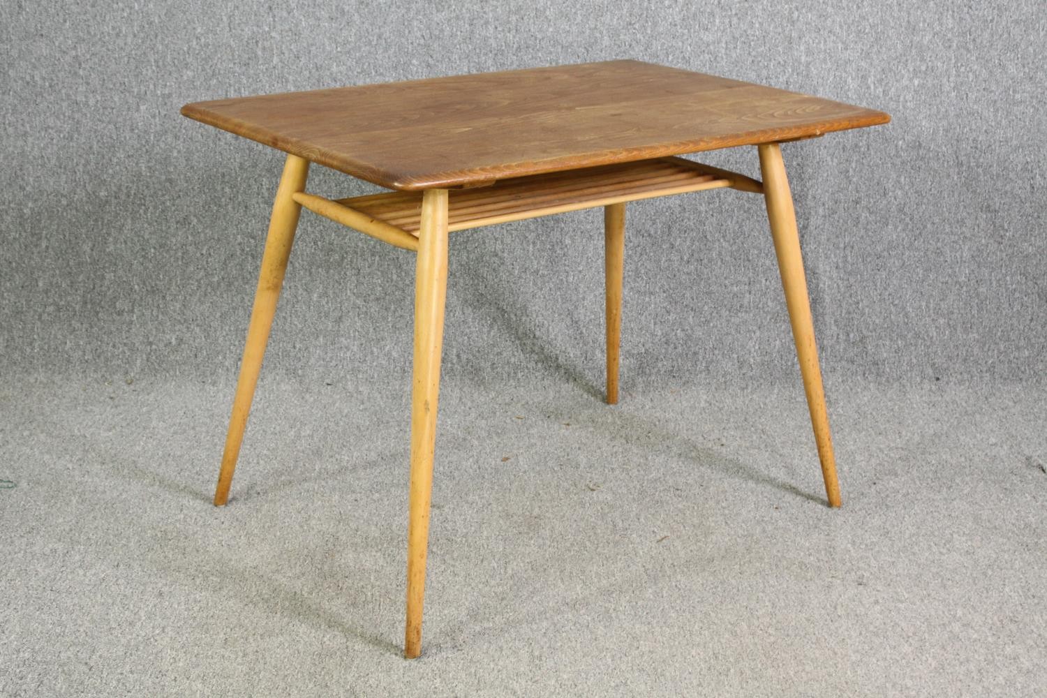 An Ercol light elm side table, with an undertier on beech supports. H.74 W.98 D.68cm. - Image 2 of 6