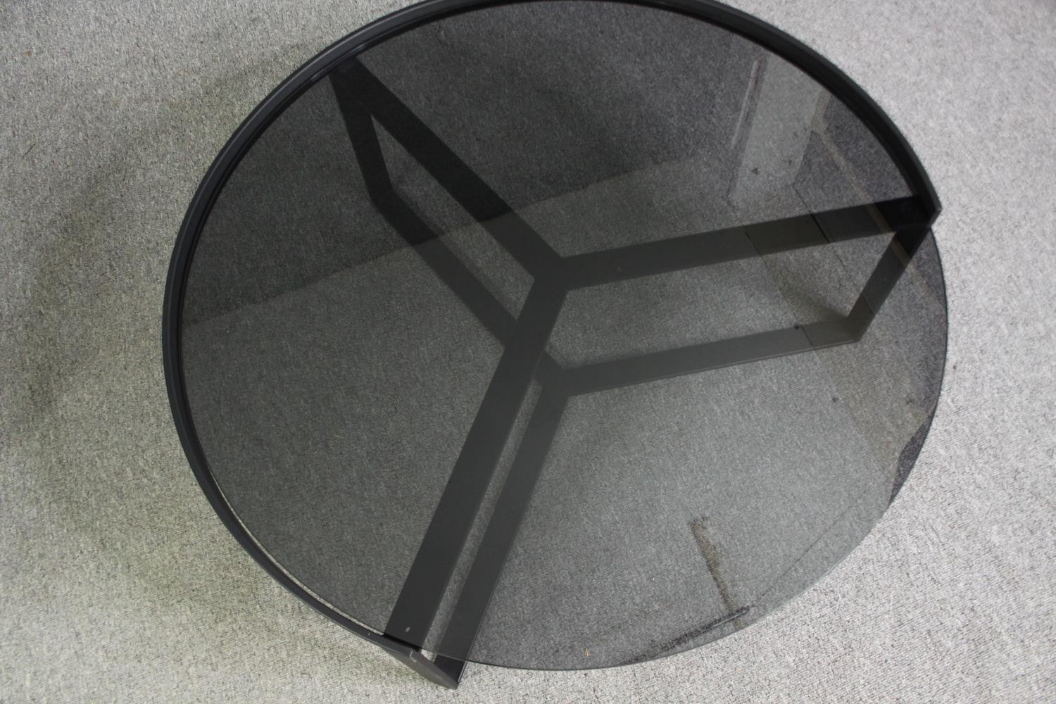 Two contemporary coffee tables with tinted glass tops and black metal supports. H.35 Dia.89cm. ( - Image 10 of 10