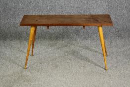 An Ercol style beech side table, with associated top and base. H.49 W.90 D.29.5cm.