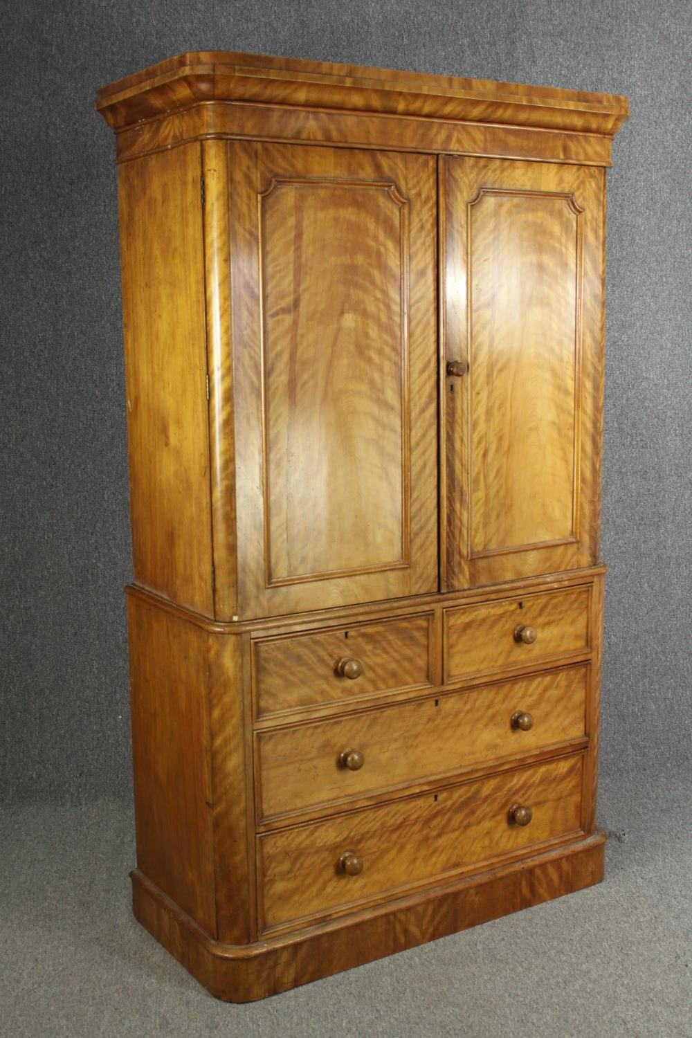 A Victorian satinwood linen press, fitted with slides above drawers on a plinth base. H.205 W.115 - Image 2 of 7