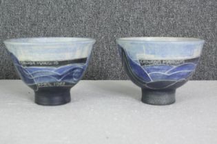 A pair of commemorative glazed earthenware bowls depicting the freight ship 'Canada Marquis', signed