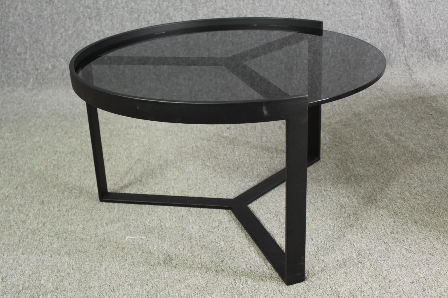 Two contemporary coffee tables with tinted glass tops and black metal supports. H.35 Dia.89cm. ( - Image 5 of 10