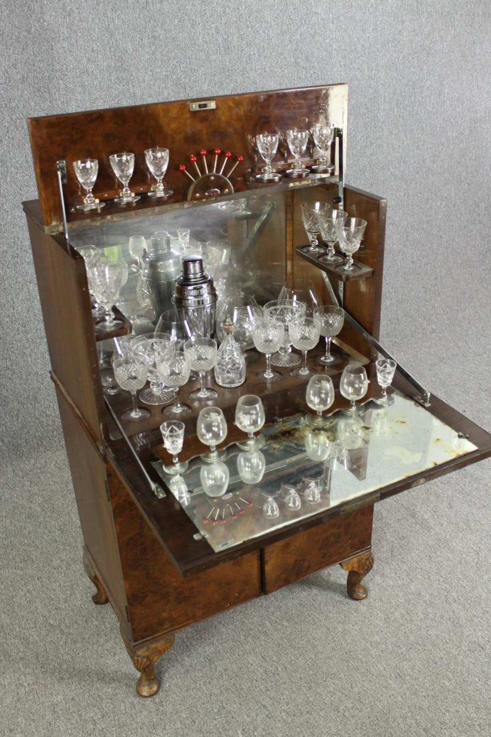 An Art Deco burr walnut cocktail cabinet, circa 1930, enclosing various cut drinking glasses and a - Image 6 of 12