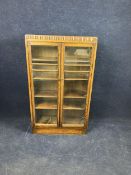 An oak glazed bookcase, early 20th century. H.130 W.75 D.26.cm