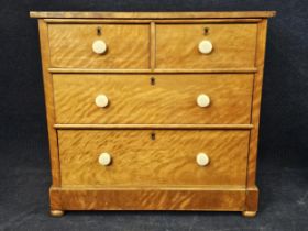 A Victorian satinwood chest of drawers. H. 91 W.96 D.49cm.