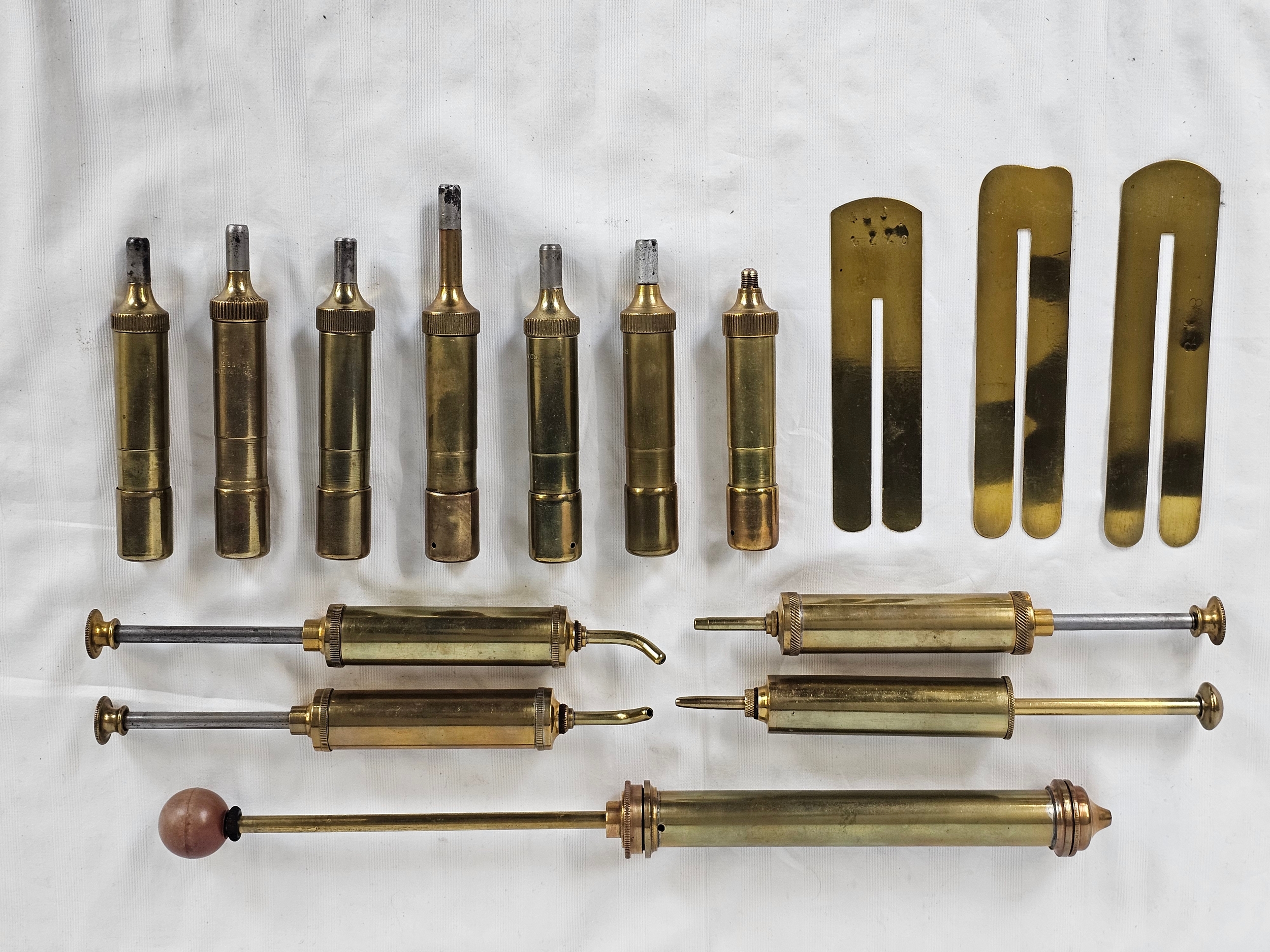 A quantity of brass airpumps and fitments