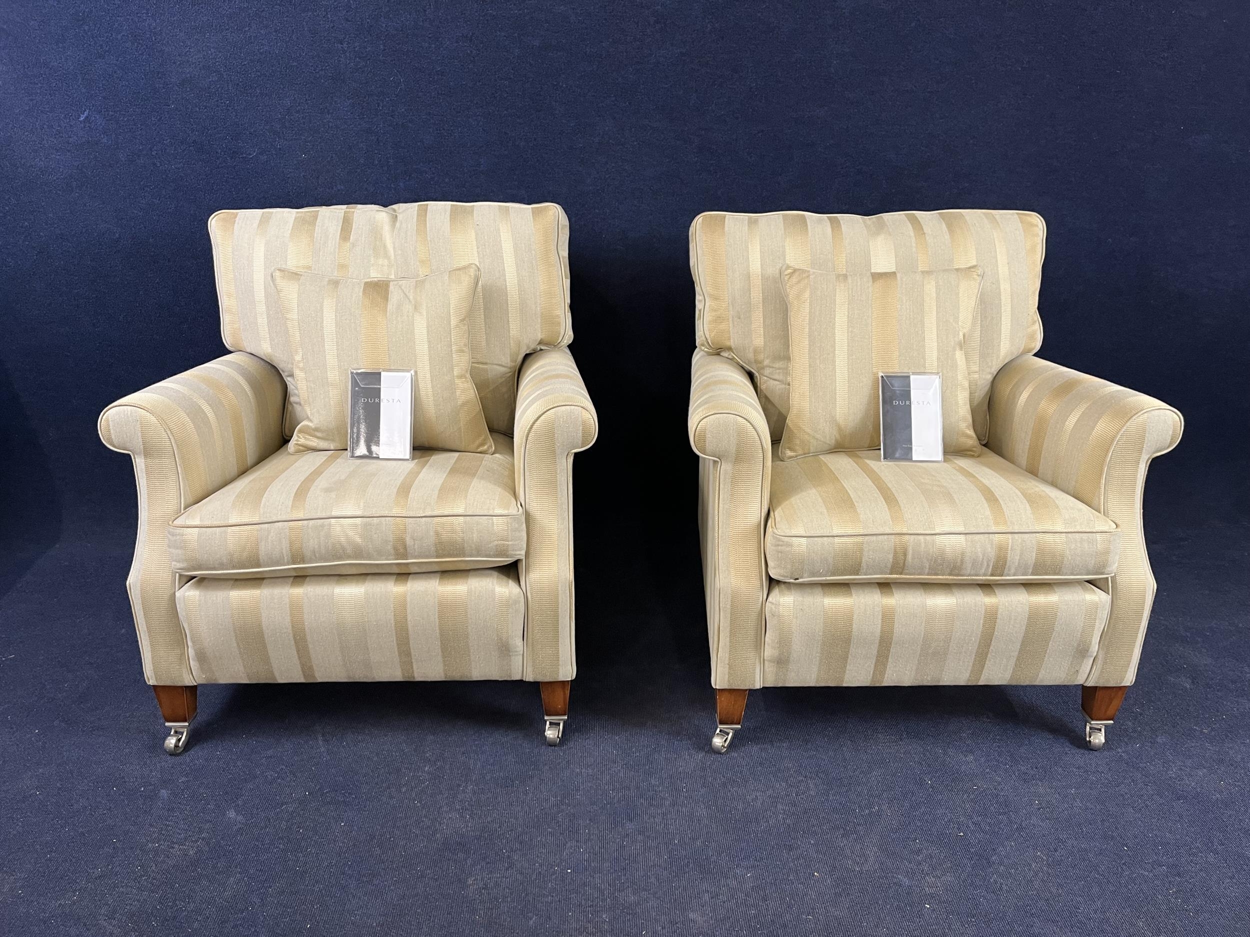 A pair of Duresta armchairs, with beige striped upholstery. H.100 W.90 D.105.cm