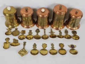 A quantity of commemorative brass and copper tea caddys and caddy spoons