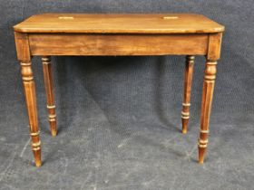 A George IV mahogany side table with hinged lid. H.75 W.95 D.52cm.