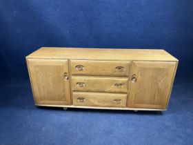 An Ercol elm sideboard. H.70 W.157 D.44.cm