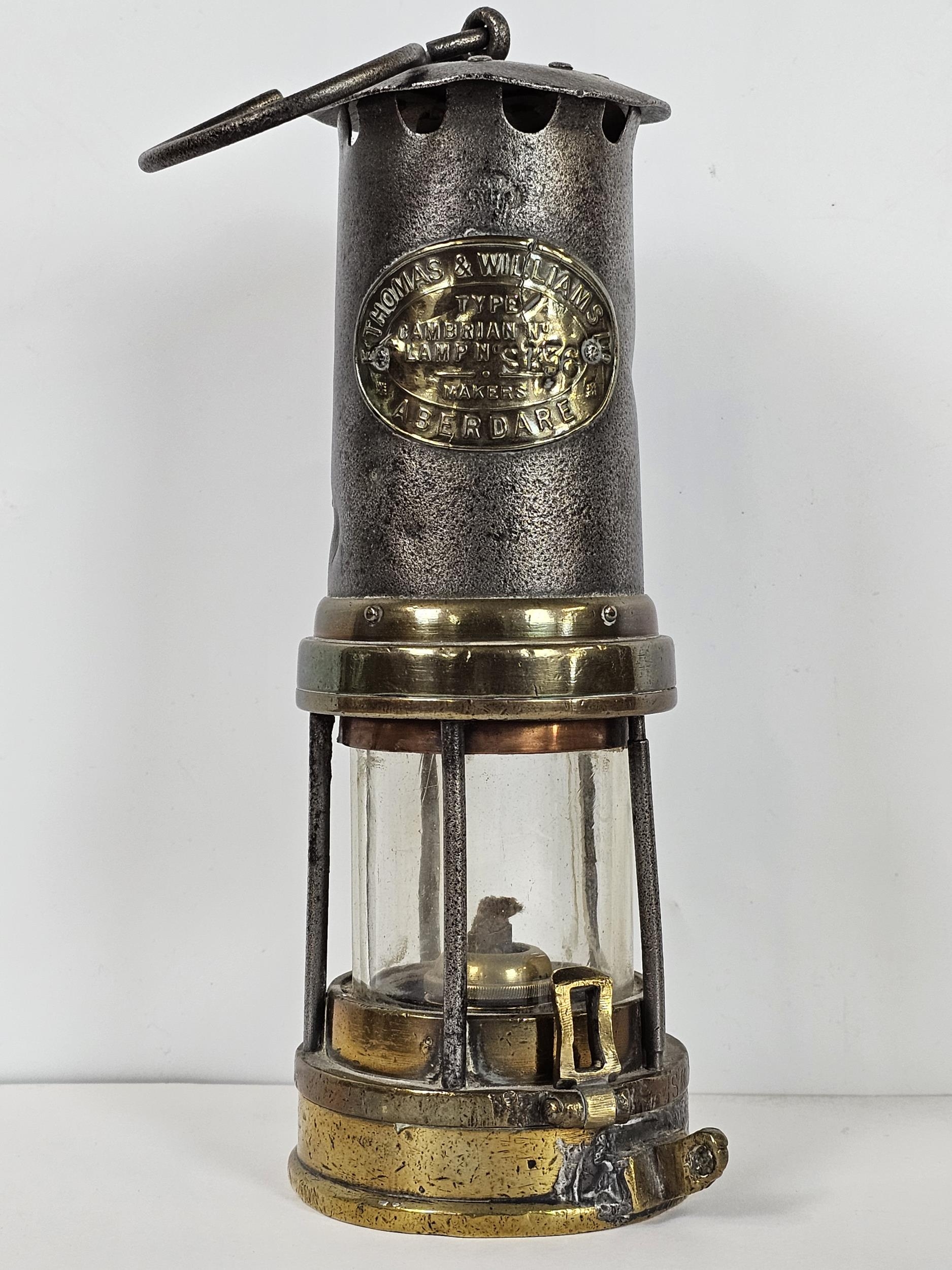 Three miner's lamps, including a Thomas and Williams, J H Naylor of Wigan, and another. Largest is - Image 2 of 17