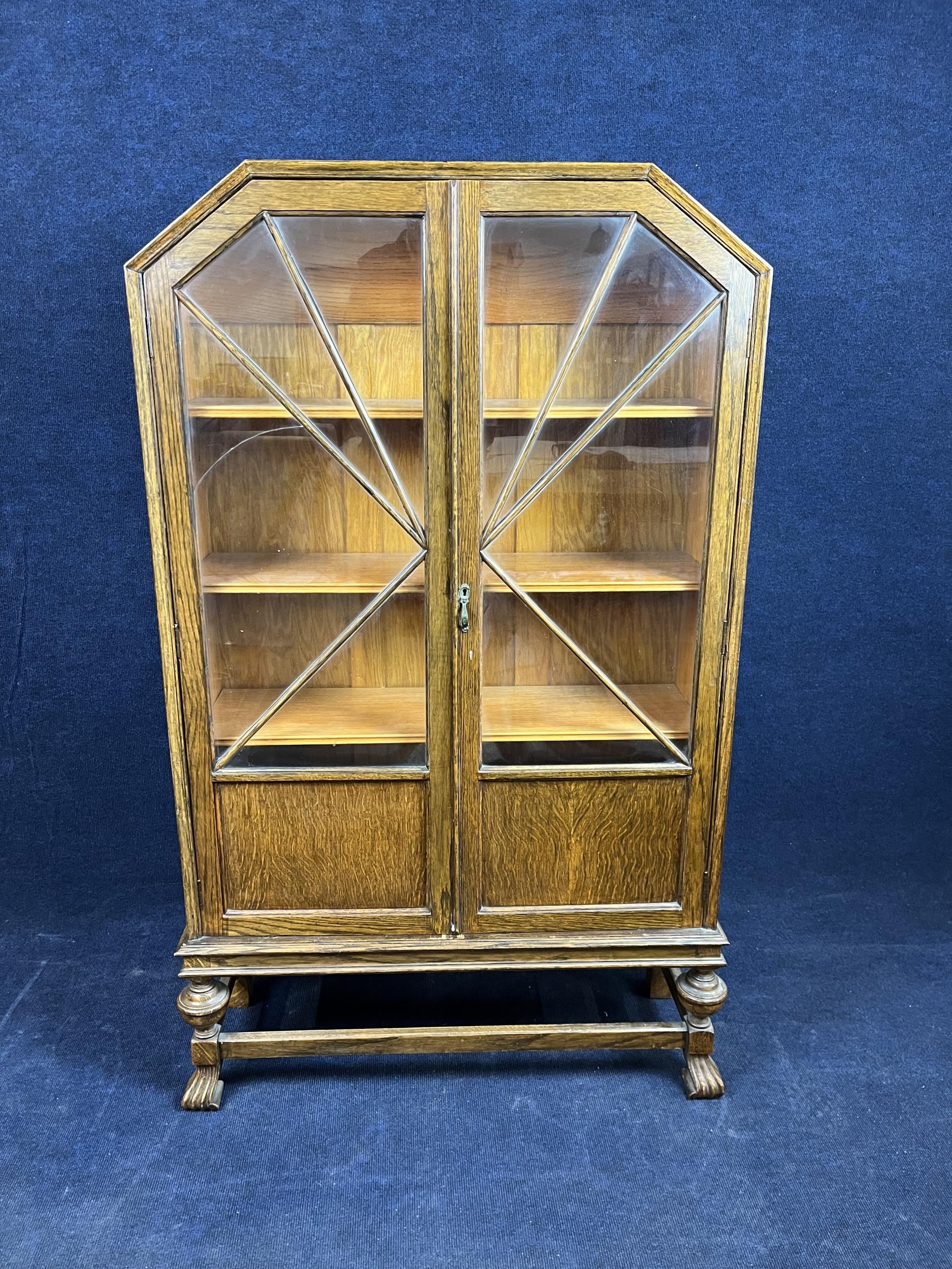 An Art Deco oak display cabinet. H.155 W.87 D.30.cm